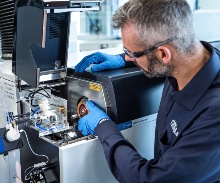 A technician in safety glasses checking tecnical equipment 