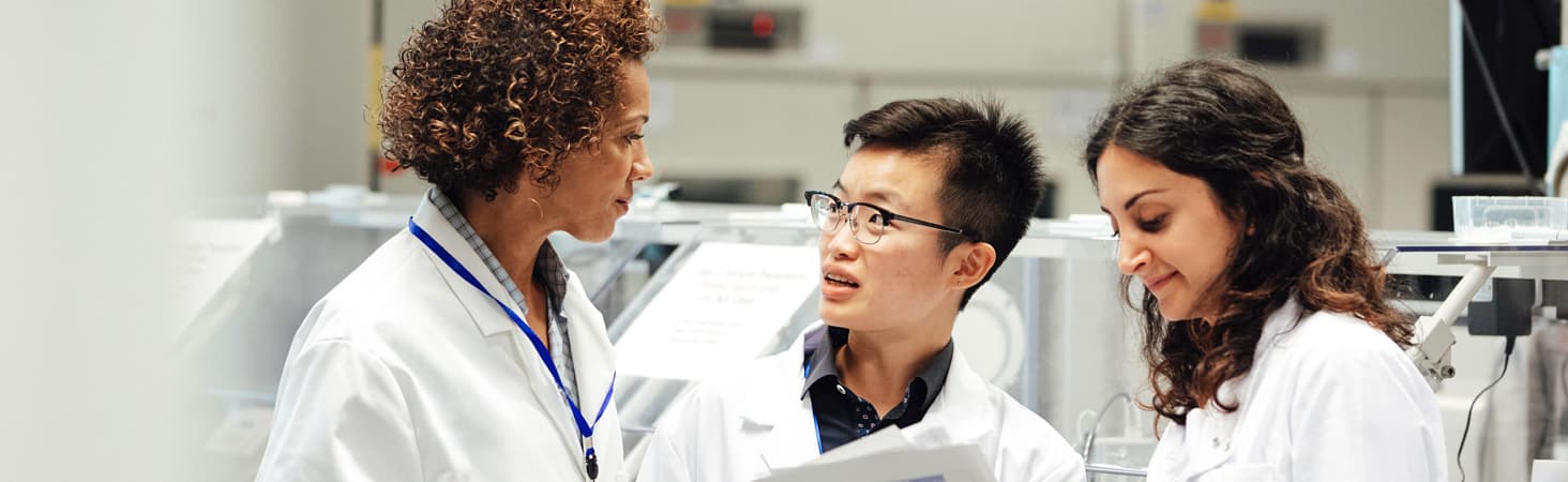 A group of laboratory employees in conversation
